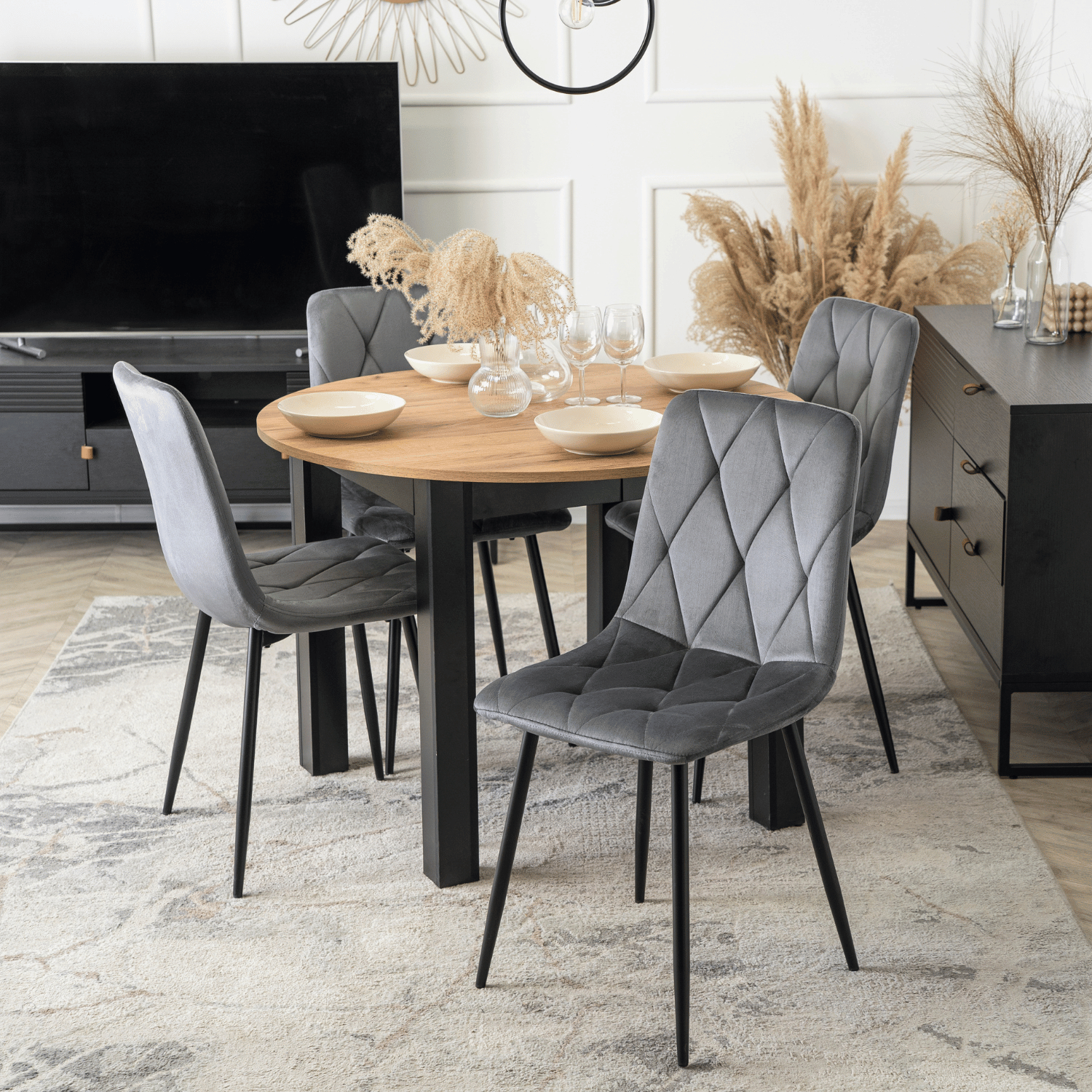 Zestaw Stół Okrągły Rozkładany HARRY 102-142 cm Dąb Craft/Czarny i 4 Krzesła Tapicerowane ROBIN Szare Nowoczesne W.HARRY/DC/CZ/S/ROBIN/P/V/Z4/K